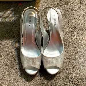 A shiny silver pair of heels
